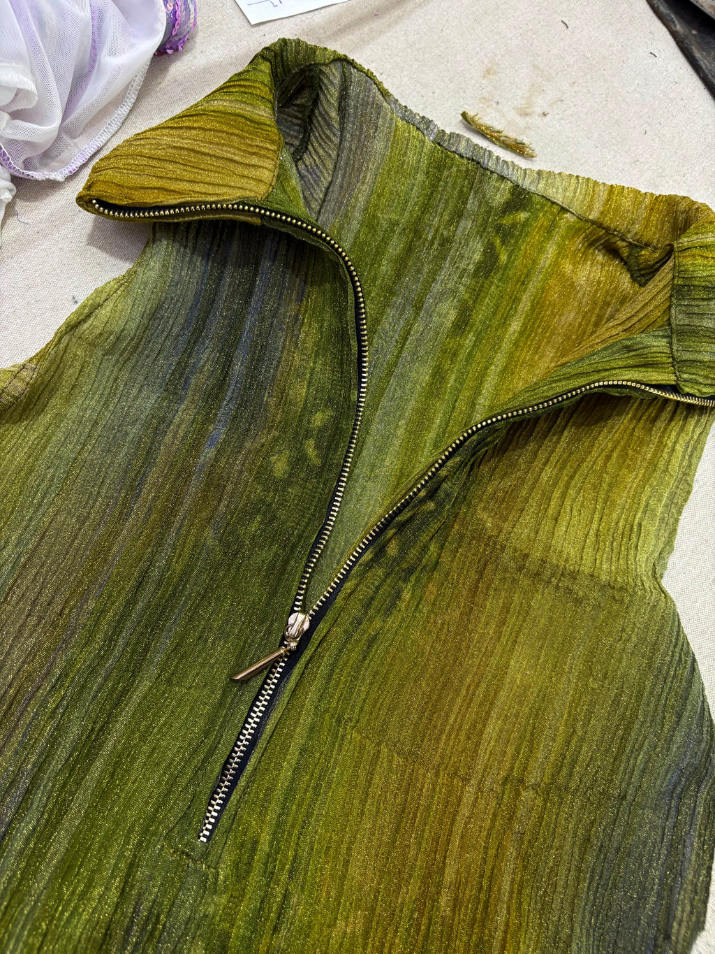 pleated quarter zip